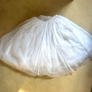 Long ballet tutu with 4 layers of veil. Calf length with ribbon ties